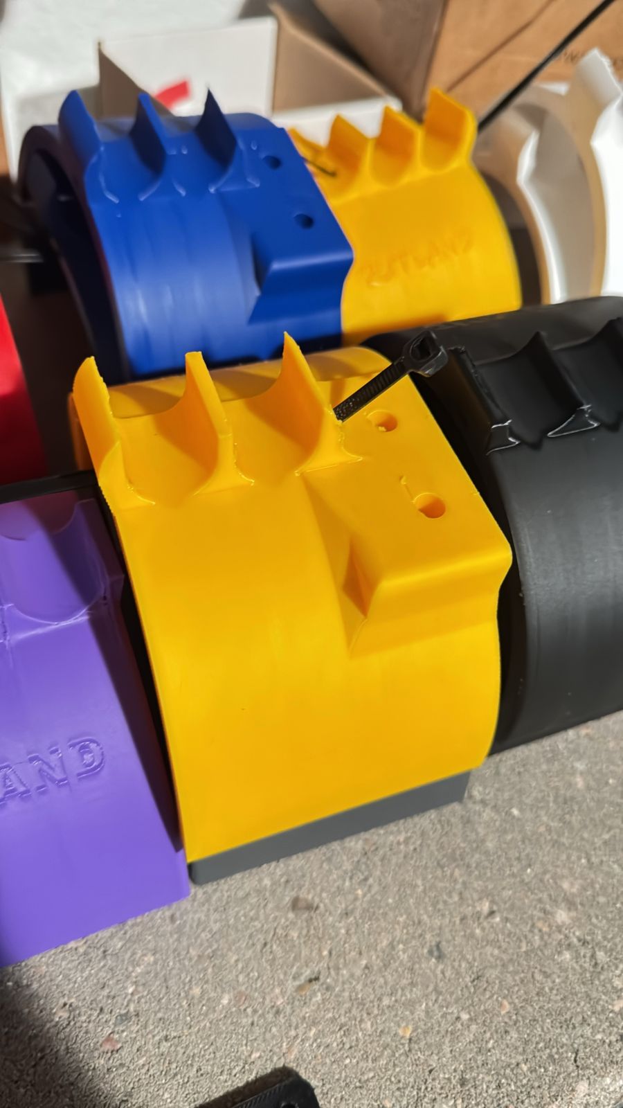 Multi-color run of custom clamp brackets